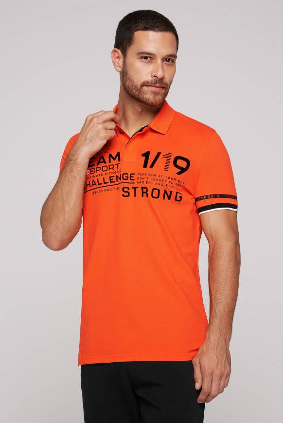 Soccx Pikee-Polo mit Flockprint signal orange Super Sparpreis